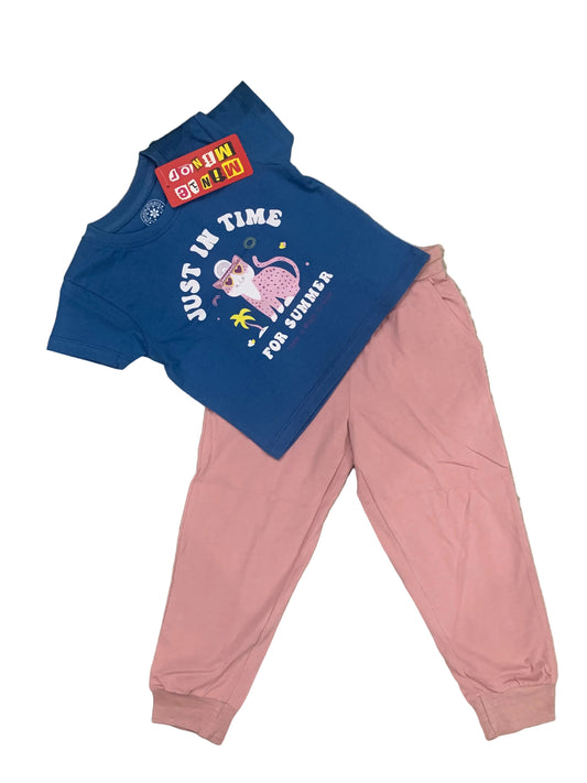 Blue hoodie with pink pants on a textured surface