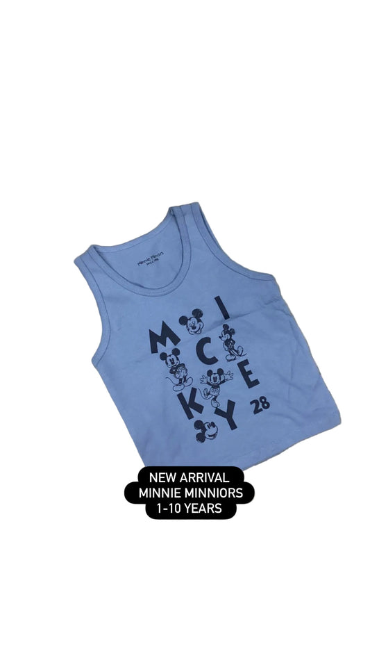 Blue tank top with Mickey Mouse design on a fluffy surface with flowers.