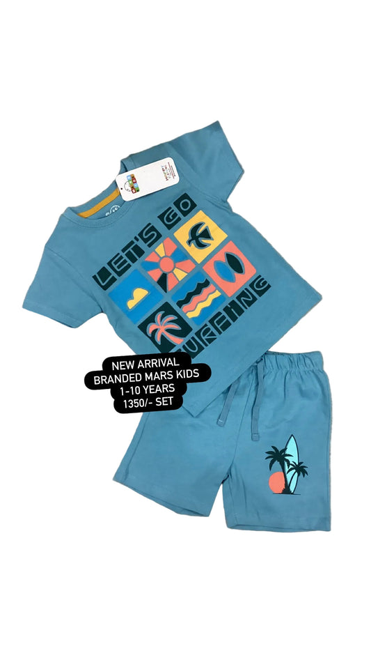 Blue children's t-shirt and shorts set with colorful graphics on a textured surface.