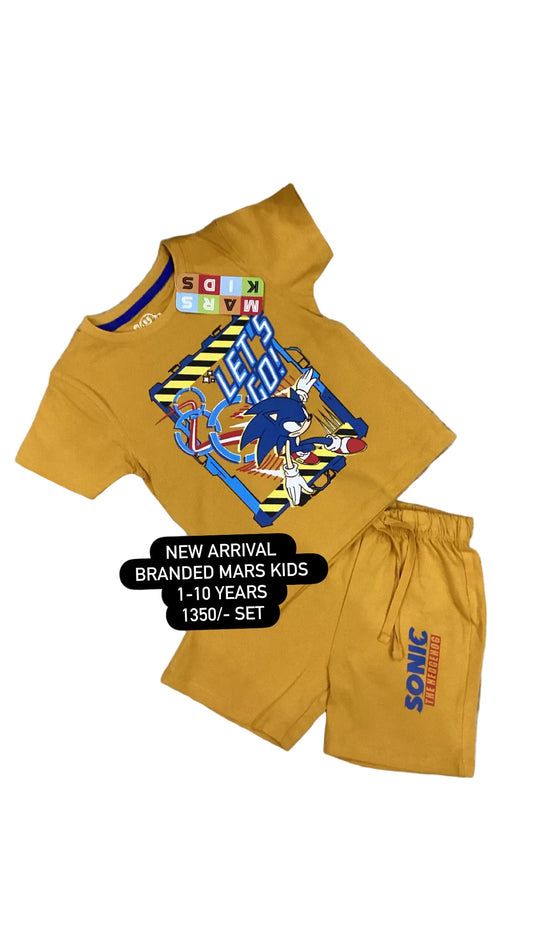 Yellow children's outfit with Sonic the Hedgehog design on a textured surface.