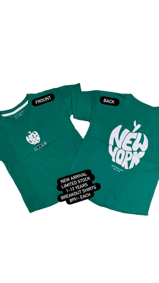 Two green t-shirts with text on a textured surface with flowers in the background