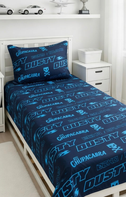 Bedding set with 'Chupacabra' and 'Dusty' branding on a bed in a room.